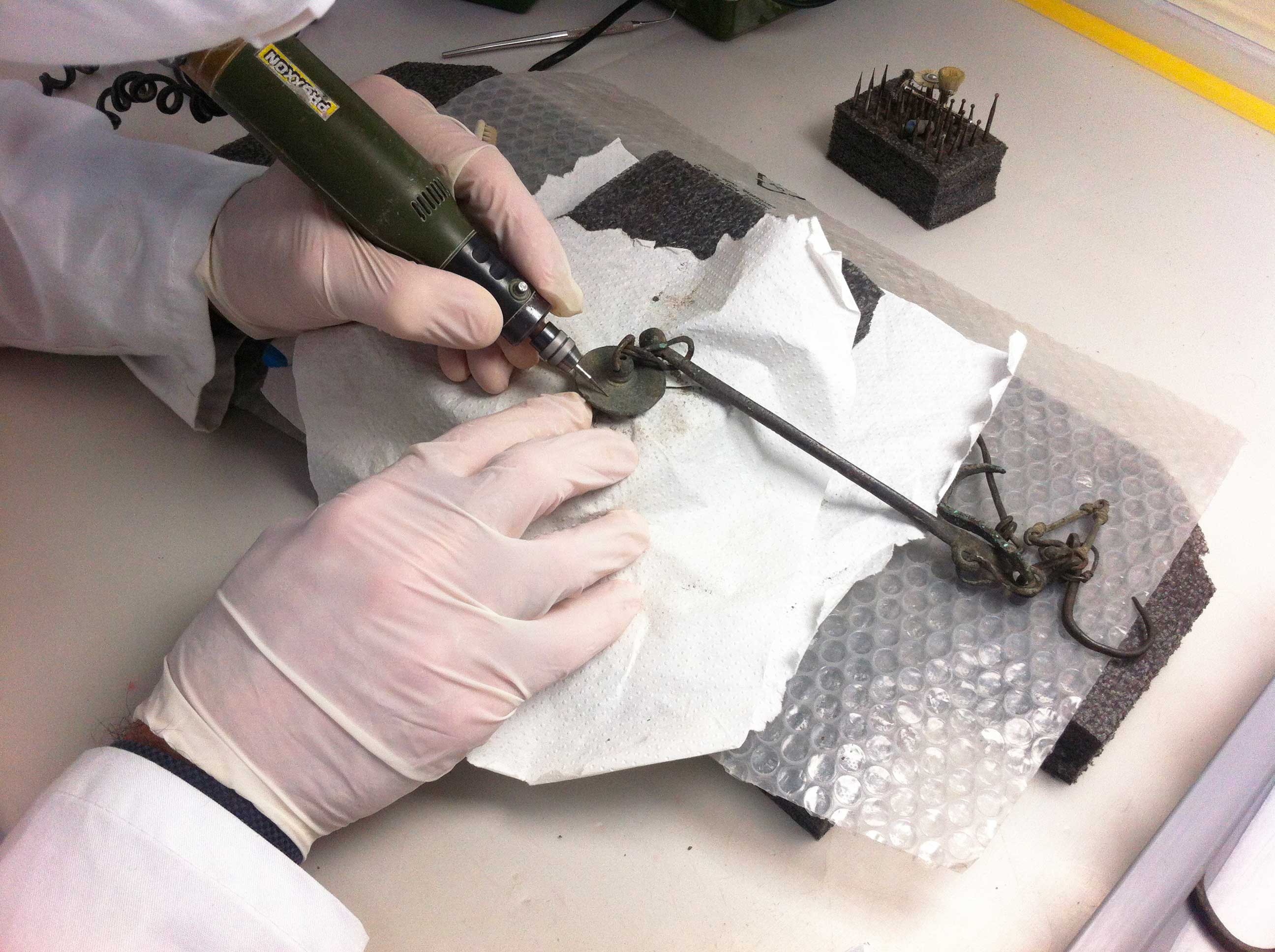 Restorer working on the scales